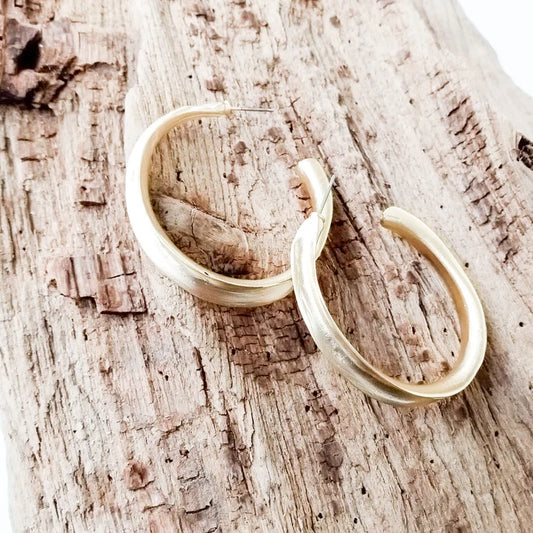 The Ingrid LUXE Wavy Large Hoop Earrings by Virtue Jewelry in Gold