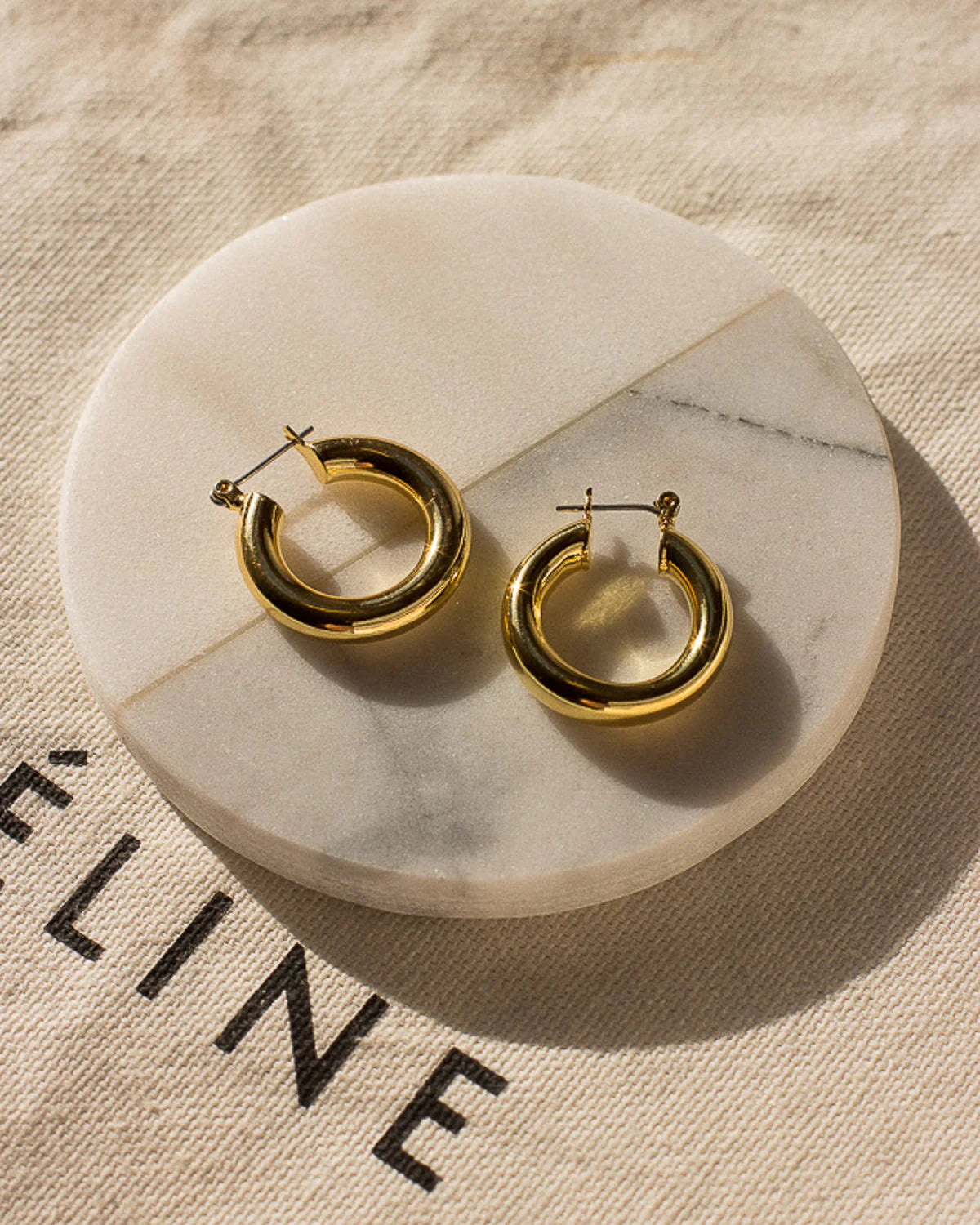 Baby Amalfi Tube Hoops by LUV AJ in Gold