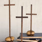 Set of three scrap metal crosses with caged rock bases by Kalalou