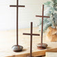 Set of three scrap metal crosses with caged rock bases by Kalalou