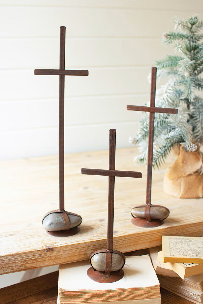 Set of three scrap metal crosses with caged rock bases by Kalalou