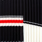 Peggy Stripe Pleated Skirt by Wild Cosmos in Black Mix