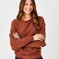 Lincoln Slash Neck Batwing Knit Sweater by Suzy D London in Pumpkin