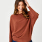 Lincoln Slash Neck Batwing Knit Sweater by Suzy D London in Pumpkin